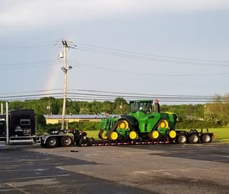 a tractor trailer with a rainbow - colored rainbow - colored rainbow - colored rainbow -