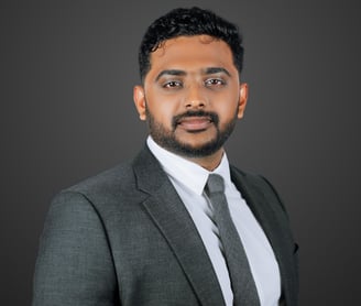 a man in a suit and tie with a beard