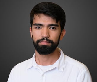 a man with a beard and a white shirt