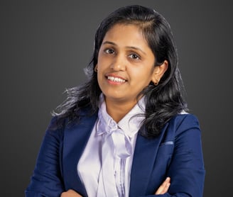 a woman in a blue suit and white shirt