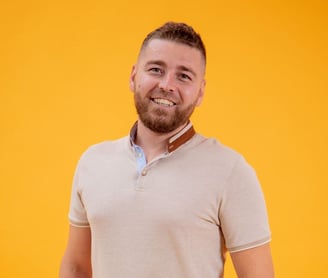 a man with a beard and a beard, smiling