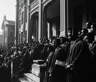 a group of students standing in front of howard university graduation ceremony
