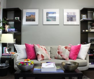 a therapy room with a couch and a coffee table