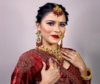 a woman in a red dress and jewelry