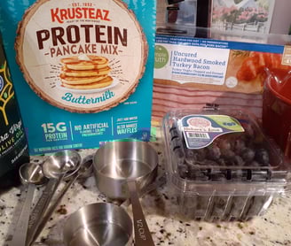 protein pancakes w bueberries and bacon