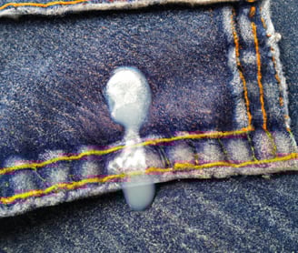 Hot glue on blue jeans