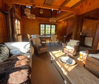 a living room with a couch and a table