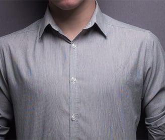 a man in a gray shirt and tie moire effect