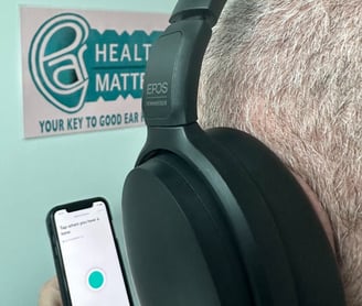 A man doing an online hearing test