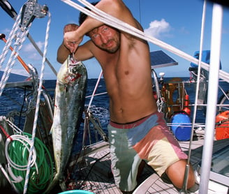 Yanne with Dorado fish caught from his yacht