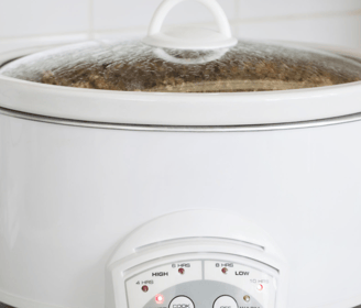 a slow cooker with a potted potted food