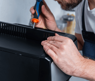 a man in overalls and overalls is using a pair of scissors and a