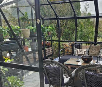 A garden design in Norway by garden designer Magnus Steen Showing the interior of a greenhouse