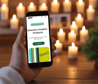 person holding cell phone in front of candles