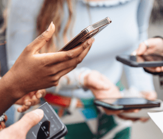 a group of people holding cell phones