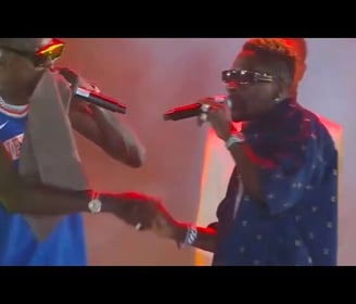 Vybz Kartel shaking Shatta Wale's hands on stage at his Freedom Concert.
