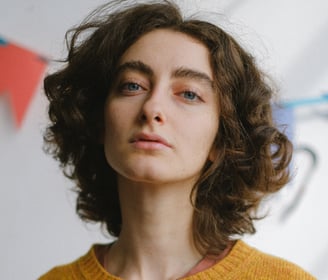 a woman with a yellow sweater and a yellow sweater
