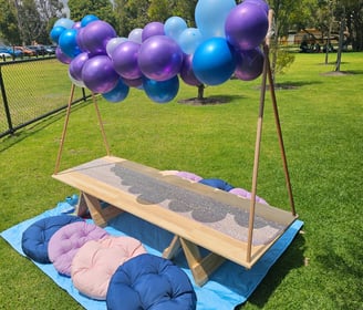 teepee picnic table hire frozen with balloon garland