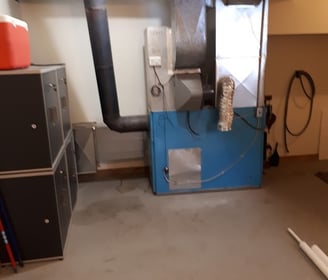 Old furnace removed before new Napoleon installation by Bystrom Industries in Kamloops