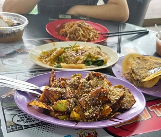 rojak, cucumber, fried tofu and pineapple tossed in a dark sticky sweet and spicy sauce 