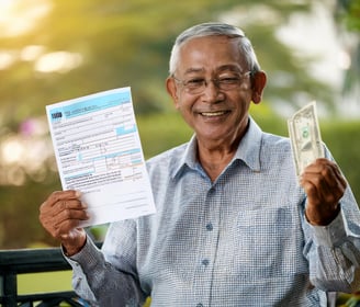 senior citizen receiving big tax refund