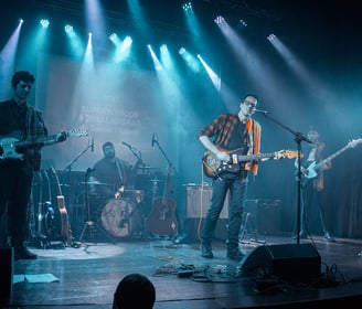 The Supersonicos playing surf music in a concert