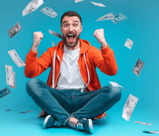 a man sitting on a floor with money bills and money