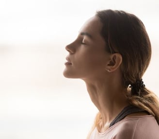 a woman with her eyes closed