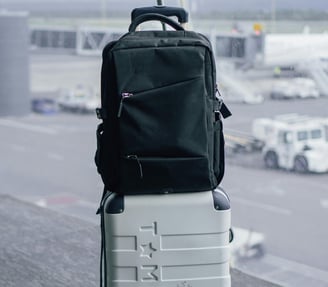 a suitcase with luggage on a luggage bag