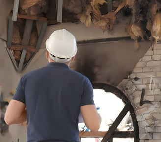 loss assessor inspecting fire damage to a residential property during an insurance assessment