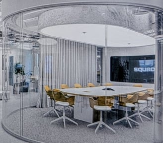 a modern office with a large window with Smart Film applied in on mode trasparency