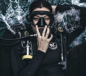 Woman in scuba gear doing bankroll entry in Gili Trawangan