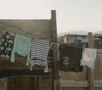clothes hanging on a clothes line in a yard
