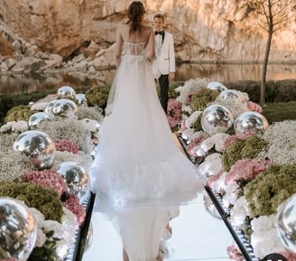 Elegant mirror silver balls reflecting ambient lighting at a luxurious Santorini event.