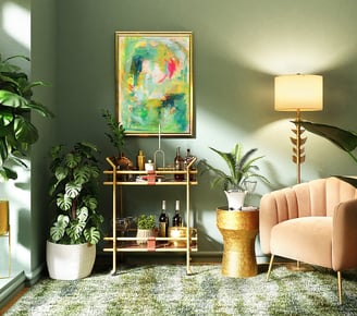 a living room with a couch, chair, and the painting "gifts of abundance" above, wonderful greens