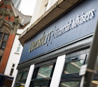 a sign that says 'Queensbury Financial Advisers'