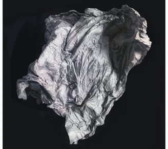 An abstarct photo of a sheet or membrane floating in a black space
