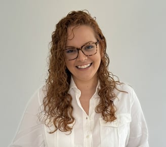a woman in a white shirt and jeans