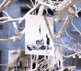 Art installation for My Beautiful Torino event with white tree and watercolor artworks