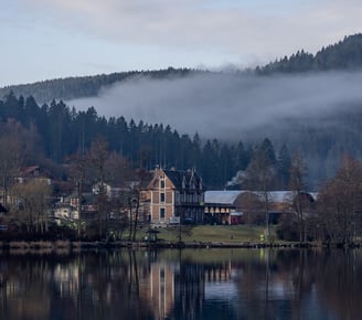 a house with a large lake in the background