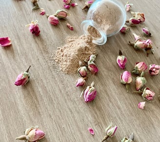 a jar of dried flowers on a table