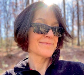 a woman in sunglasses and sunglasses talking on a cell phone