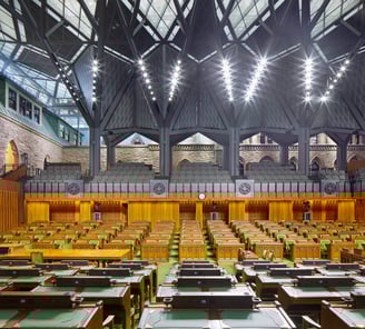 a large room with a lot of wooden tables and chairs