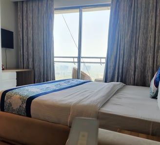 Image of a clean and comfortable bed inside a luxury apartment