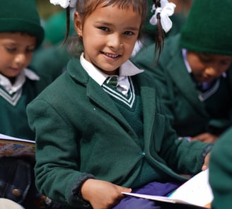 Child sitting with a book in her hands
