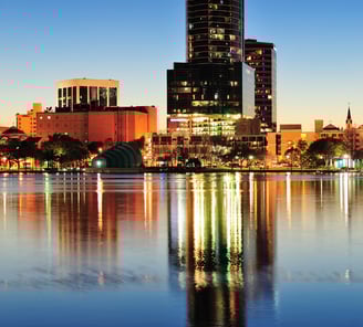 a city skyline with a river and a city skyline