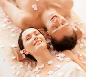 a man and woman in a spa treatment room
