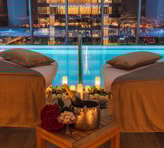 a couple of chairs with candles and candles