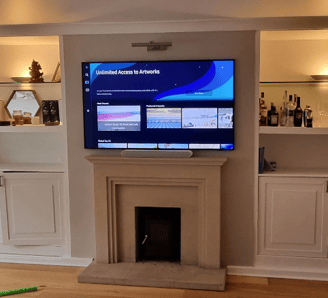 Professional TV wall mounting service. TV on wall above a fireplace