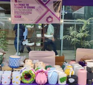 a table with a variety of ceramic products on it.